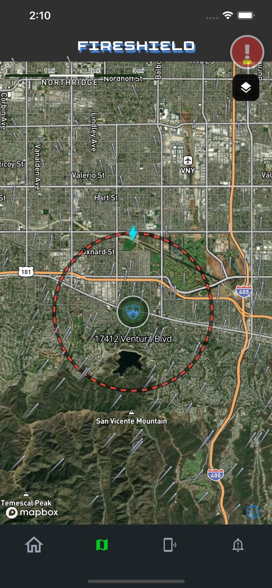 FireShield app: the map zoomed to the property, showing the activation distance drawn as a ring around the house