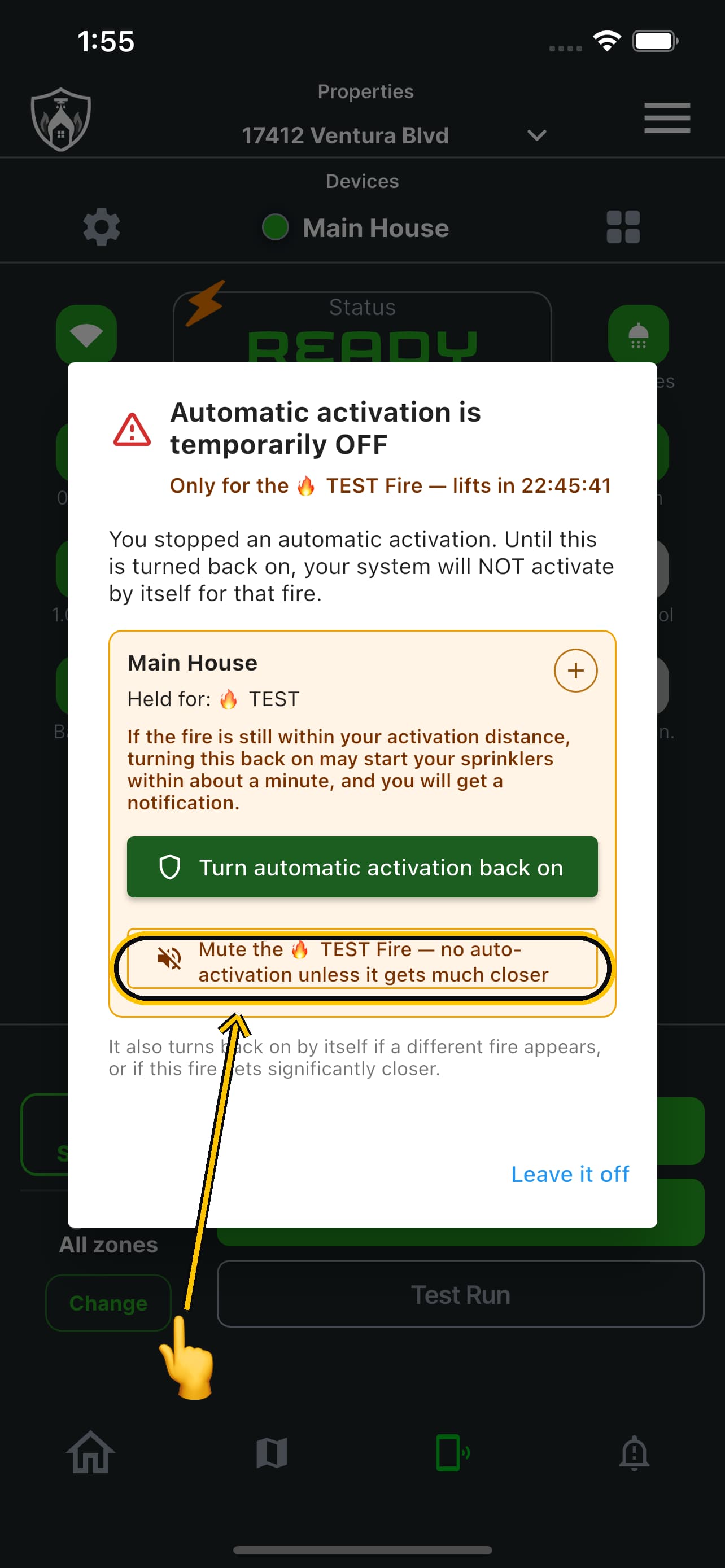 The hold notice with the mute option ringed and a finger about to press it