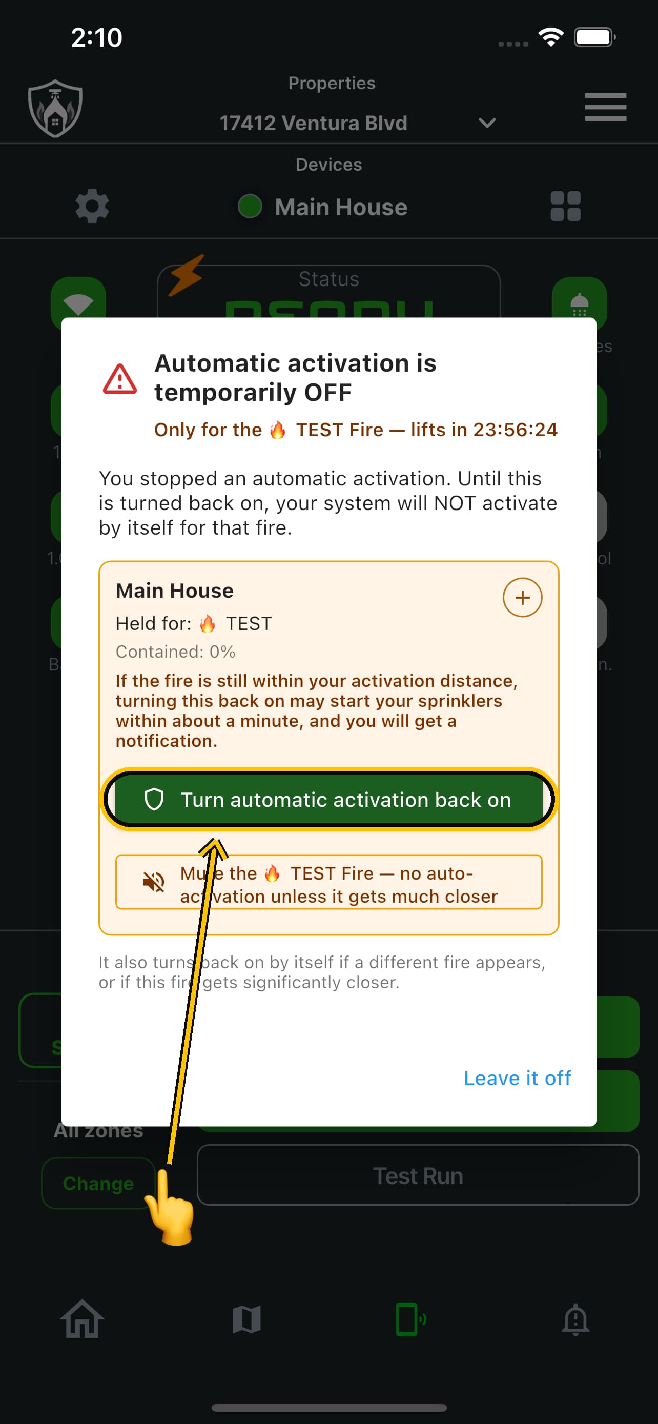 The hold notice with the turn back on button ringed and a finger about to press it