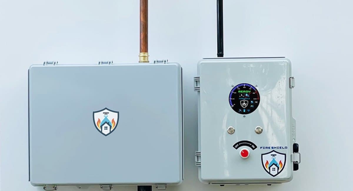 A FireShield hub and controller installed on the wall of a home