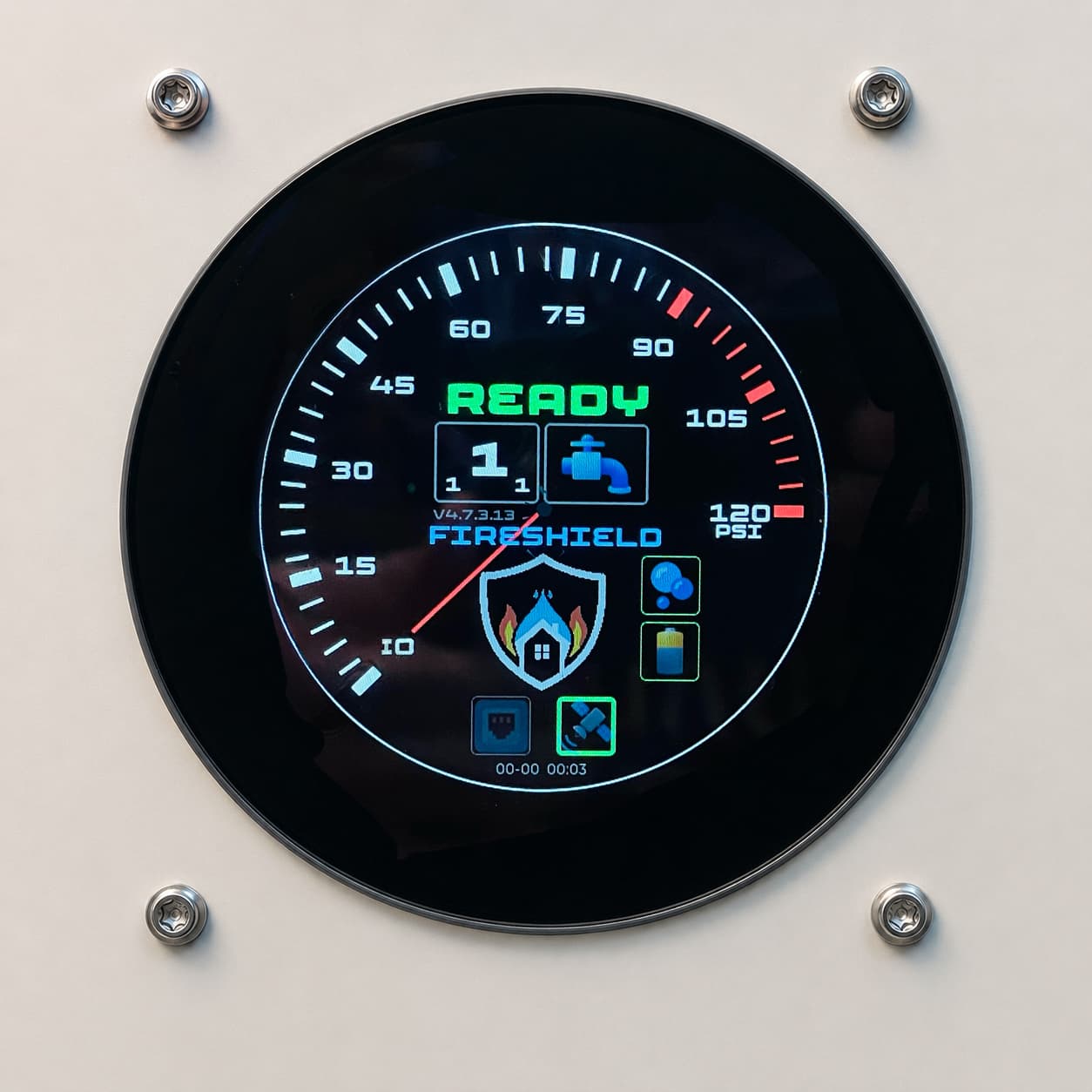 The FireShield controller display in daylight, showing READY with the supply-pressure gauge and status icons